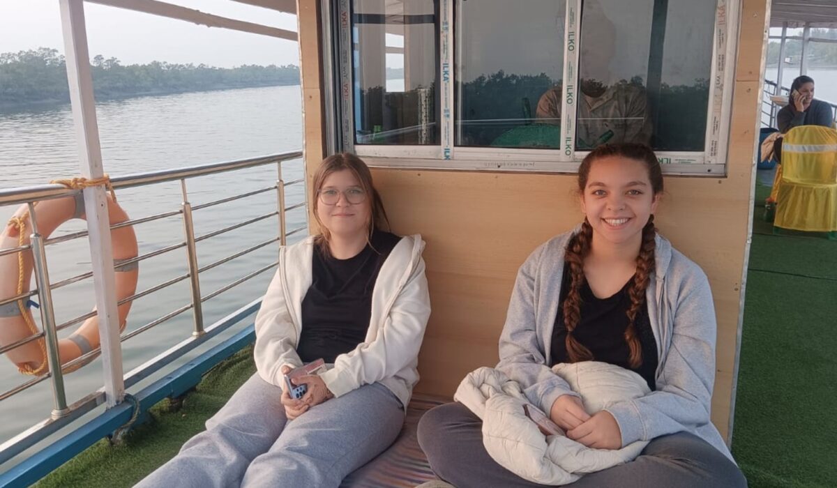 two-foreign-guests-seated-on-the-boat-during-their-2-nights-3-days-sundarban-trip